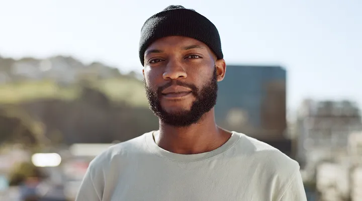 solo man smiling at camera