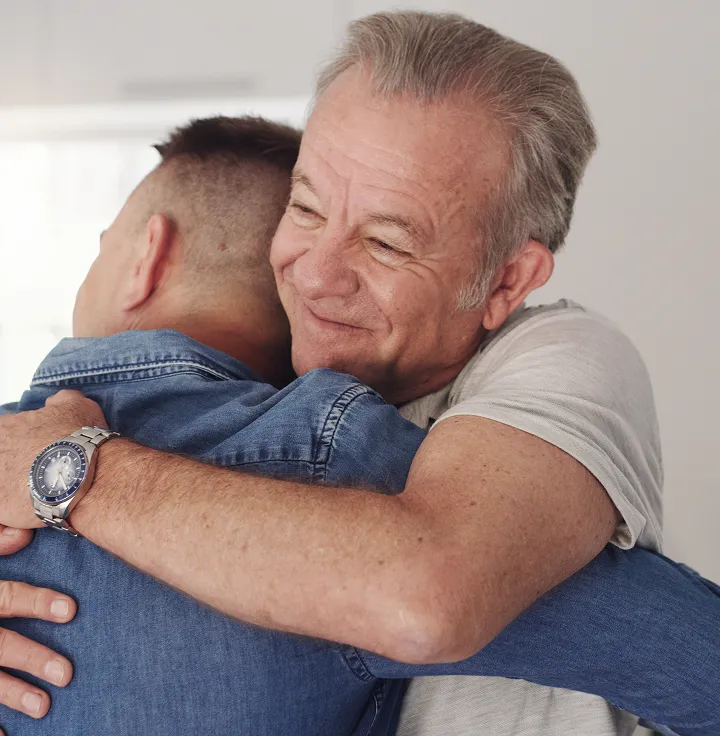 two men embrace
