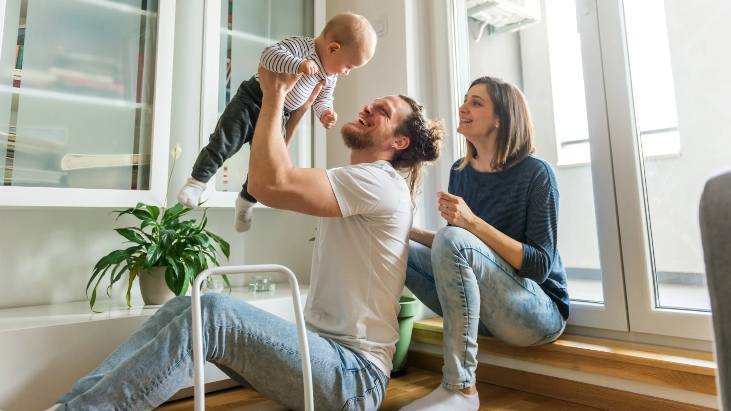 family playing with their child