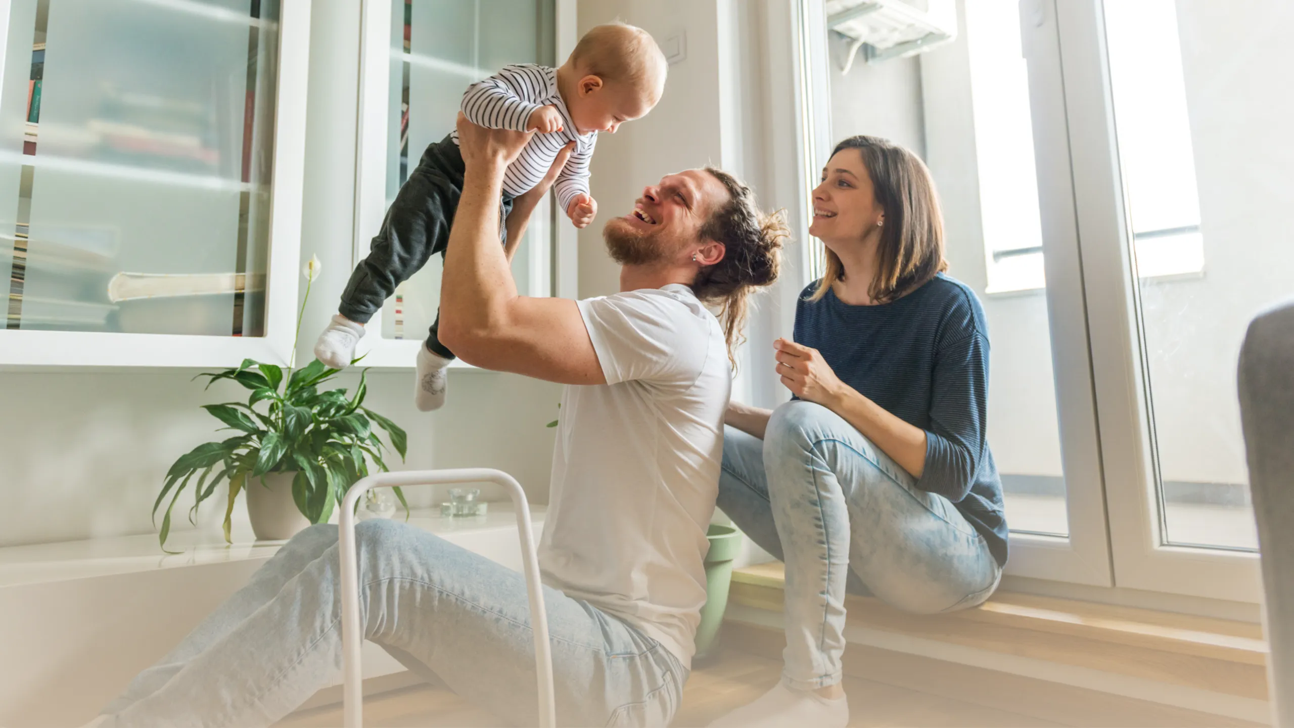 family playing with their child